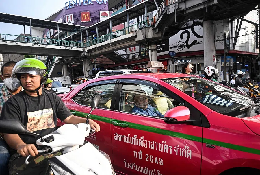 Motorists wait at a traffic intersection in Bangkok on 14 November 2024. (Lillian Suwanrumpha/AFP)