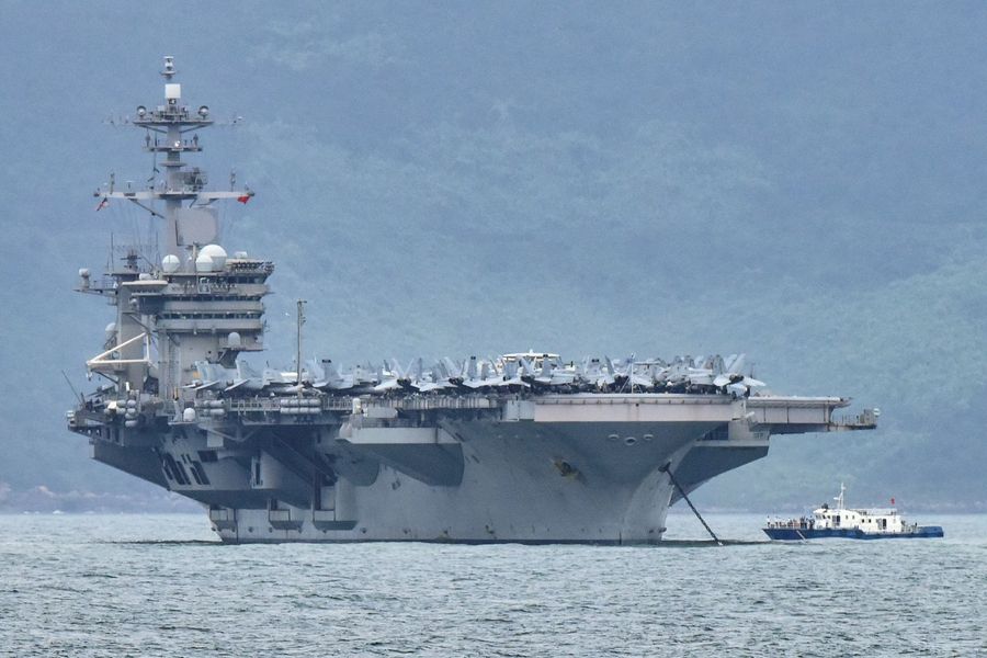 The USS Theodore Roosevelt (CVN-71) is pictured as it enters the port in Da Nang, Vietnam, on 5 March 2020. (Kham/Reuters)