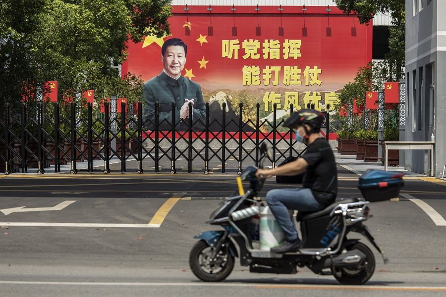 A billboard featuring Chinese President Xi Jinping is displayed at a compound in Shanghai, China, on 30 August 2021. (Qilai Shen/Bloomberg)