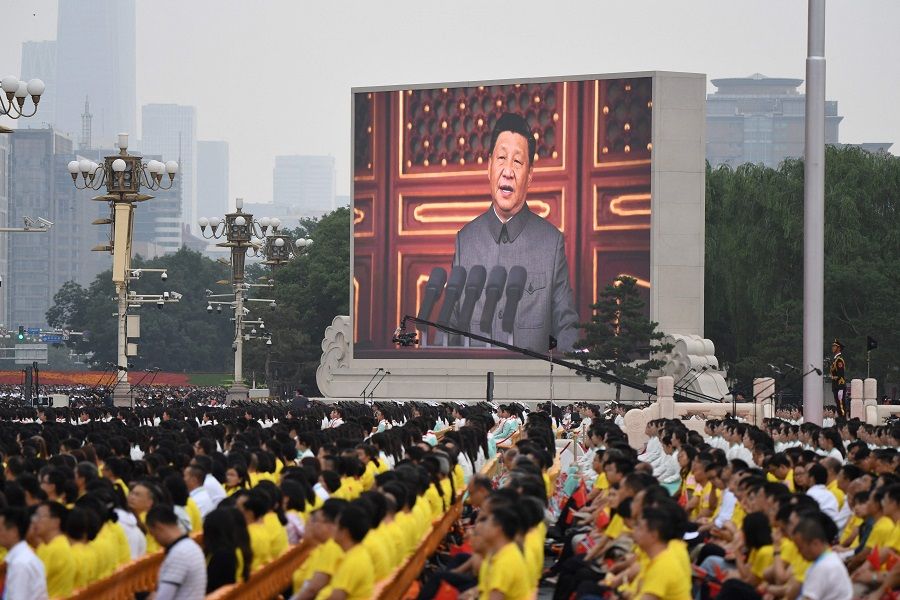 Chinese President Xi Jinping (on screen) delivers a speech during the celebrations of the 100th anniversary of the founding of the Communist Party of China at Tiananmen Square in Beijing, China on 1 July 2021. (Wang Zhao/AFP)