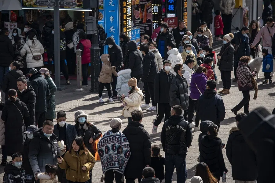 Shoppers in the Guanqian Street shopping area in Suzhou, Jiangsu province, China, on 25 January 2023. (Qilai Shen/Bloomberg)