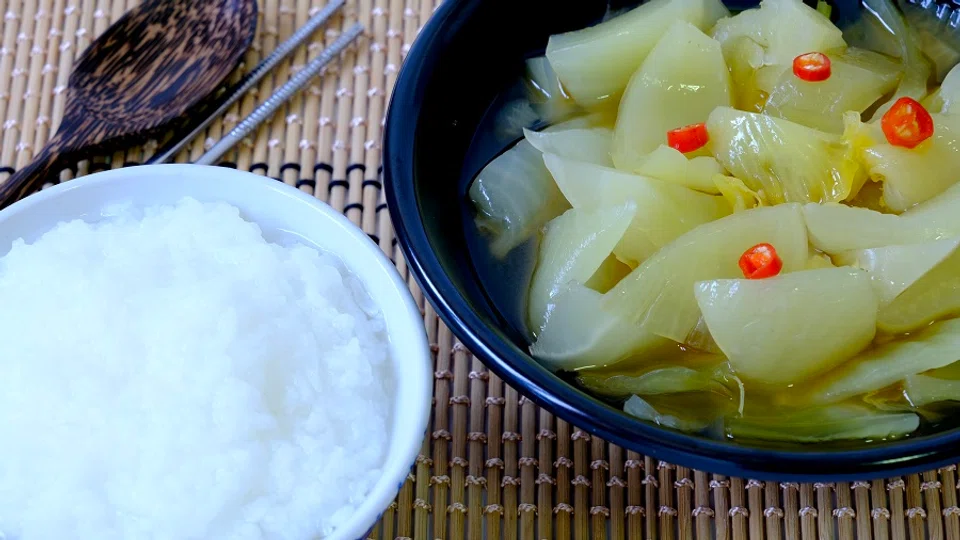 Plain porridge with pickled lettuce is enough for a hearty breakfast. (iStock)