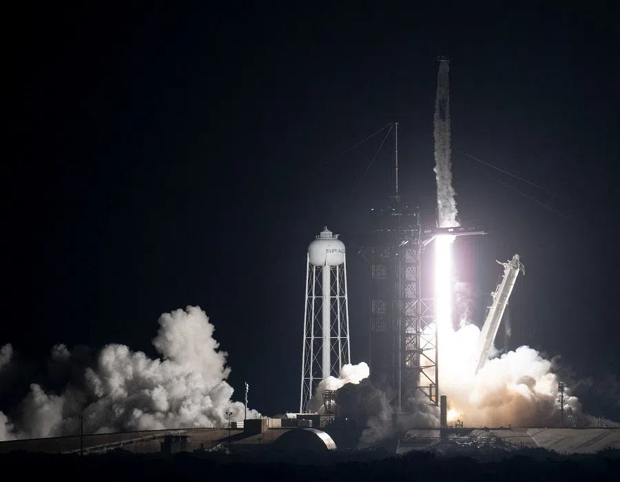 This NASA handout shows a SpaceX Falcon 9 rocket carrying the company's Crew Dragon spacecraft as it is launched on NASA's SpaceX Crew-3 mission to the International Space Station, 10 November 2021, at NASA's Kennedy Space Center in Florida, US. (Joel Kowsky/NASA/AFP)