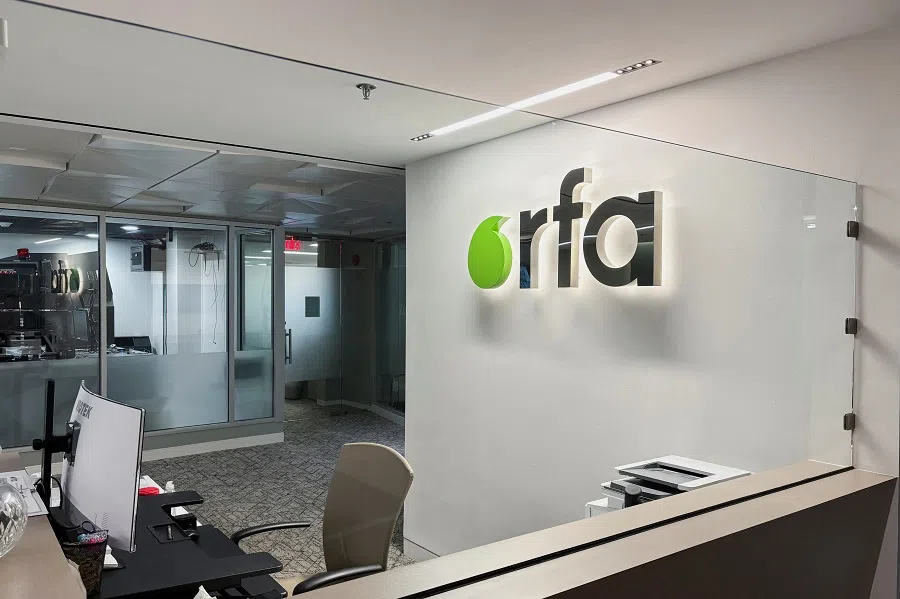 A logo of Radio Free Asia is displayed in its office in Washington, DC, US, on 15 March 2025.  (Reuters)