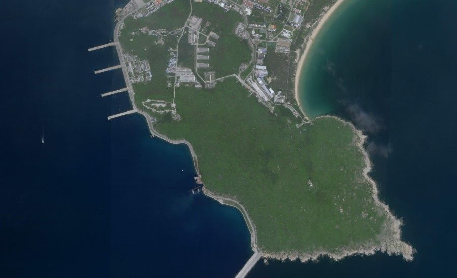 This image reportedly shows a Chinese submarine (C, bottom) entering an underground base on Hainan Island on the South China Sea, 18 August 2020. (Planet Labs, Inc./AFP)