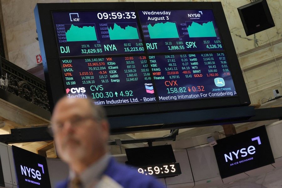A screen displays market information on the trading floor at the New York Stock Exchange (NYSE) in Manhattan, New York City, US, 3 August 2022. (Andrew Kelly/Reuters)