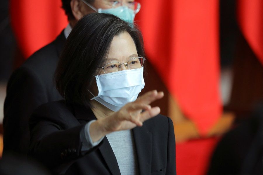 Taiwan President Tsai Ing-wen waves at the end of a rank conferral ceremony for military officials from the Army, Navy and Air Force, at the defence ministry in Taipei, Taiwan, 28 December 2021. (Annabelle Chih/Reuters)