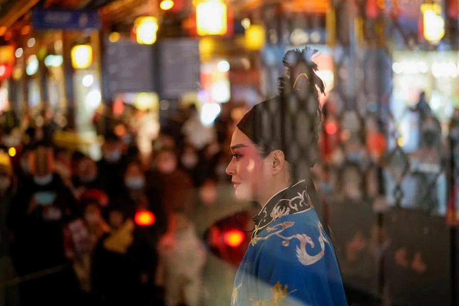 A Yue opera performer dances at Yu Garden in Shanghai, China, 15 February 2022. (Aly Song/Reuters)