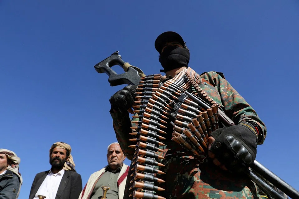 A Houthi policeman takes part in a protest against recent US-led strikes on Houthi targets, near Sanaa, Yemen, on 14 January 2024. (Khaled Abdullah/Reuters)