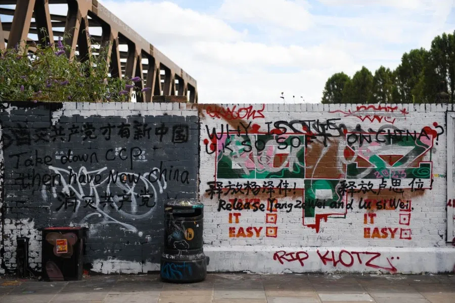 A wall covered in graffiti, including slogans critical of China's ruling party, on Brick Lane in London, UK, on 11 August 2023. The wall has now become the focal point for criticism of China and inflamed divisions online too. (Chris J. Ratcliffe/Bloomberg)