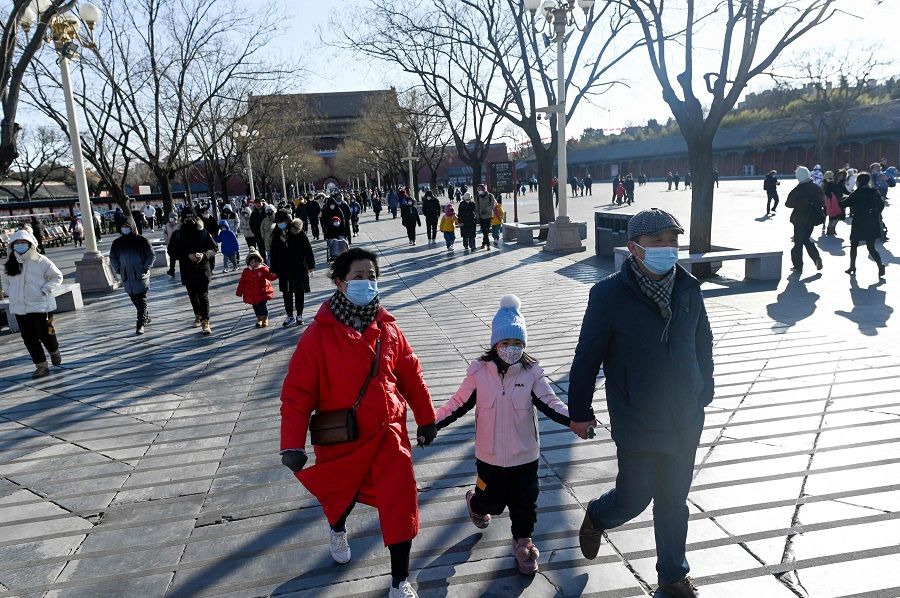 Tourists walk towards the entrance of the Forbidden City in Beijing, China, on 23 January 2023. (Wang Zhao/AFP)