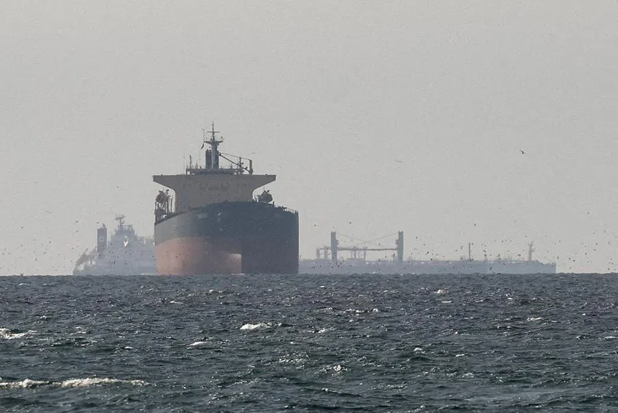 Tankers sail in the Gulf, near the Strait of Hormuz, as seen from northern Ras al-Khaimah, near the border with Oman’s Musandam governance, amid the US-Israeli conflict with Iran, in UAE, 11 March 2026. (Reuters/Stringer/File Photo)