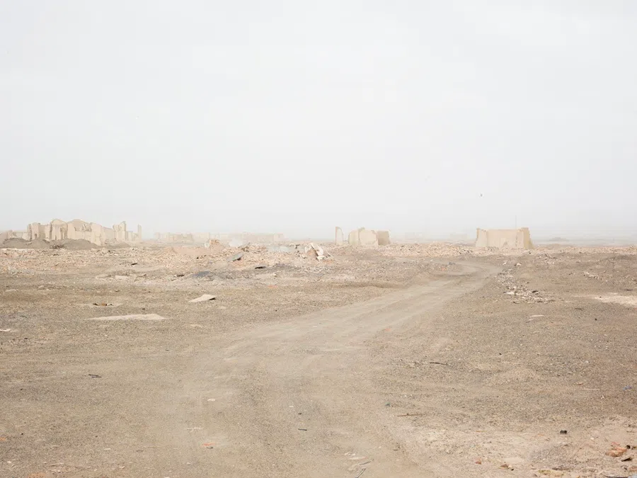 The oil town shrouded in a sudden sandstorm.