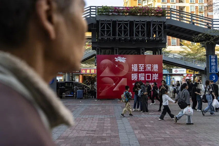 Pedestrians outside of the Futian border crossing in Shenzhen, China, on 19 January 2024. (Qilai Shen/Bloomberg)
