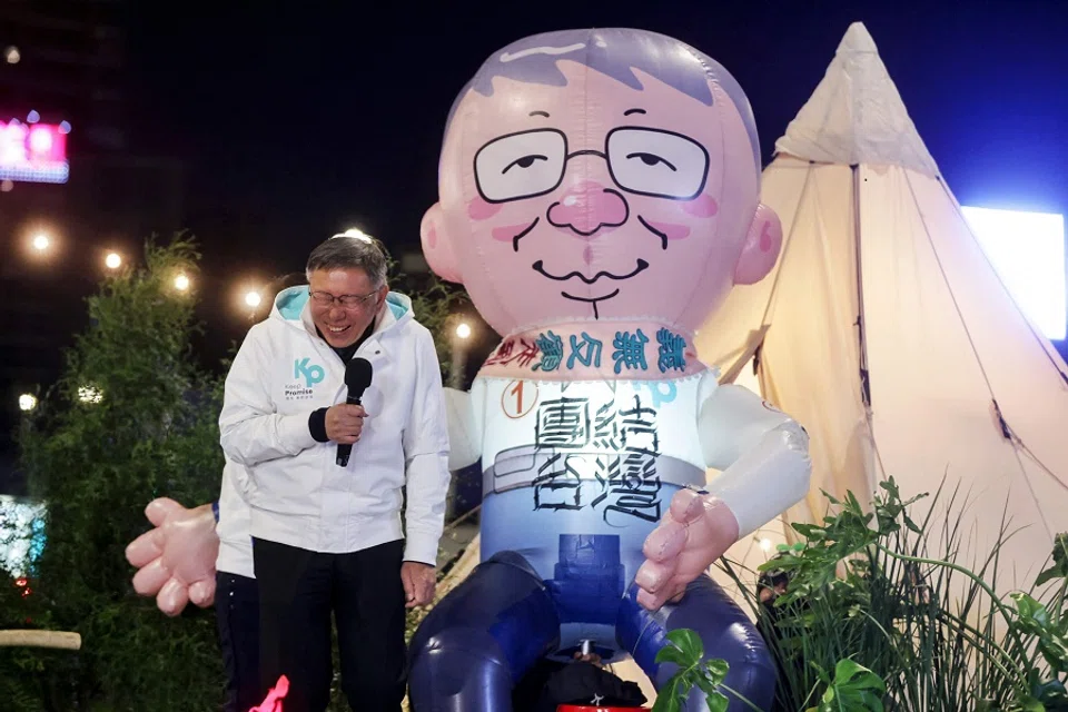 Taiwan People's Party (TPP) presidential candidate Ko Wen-je reacts to a giant inflatable balloon resembling him at a TPP event ahead of Taiwan's presidential elections in Taipei on 11 January 2024. (I-Hwa Cheng/AFP)
