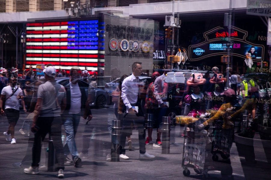 Pedestrians are reflected in a window of the Nasdaq MarketSite in New York, US, on 15 June 2022. (Michael Nagle/Bloomberg)