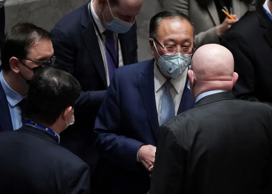 Russia's permanent representative to the UN Vassily Nebenzia speaks with China's permanent representative to the UN Zhang Jun as the UNSC assembles to vote for a rare emergency special session of the 193-member UNGA on Russia's invasion of Ukraine, at the UN Headquarters in Manhattan, New York City, US, 27 February 2022. (David 'Dee' Delgado/Reuters)