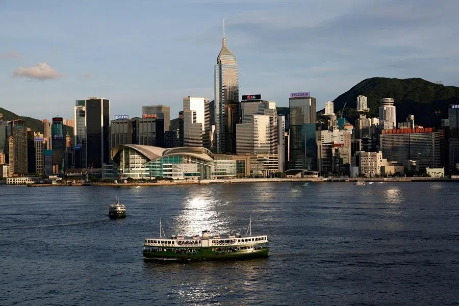 A Star Ferry boat crosses Victoria Harbour in front of a skyline of buildings in Hong Kong, China, on 29 June 2020.