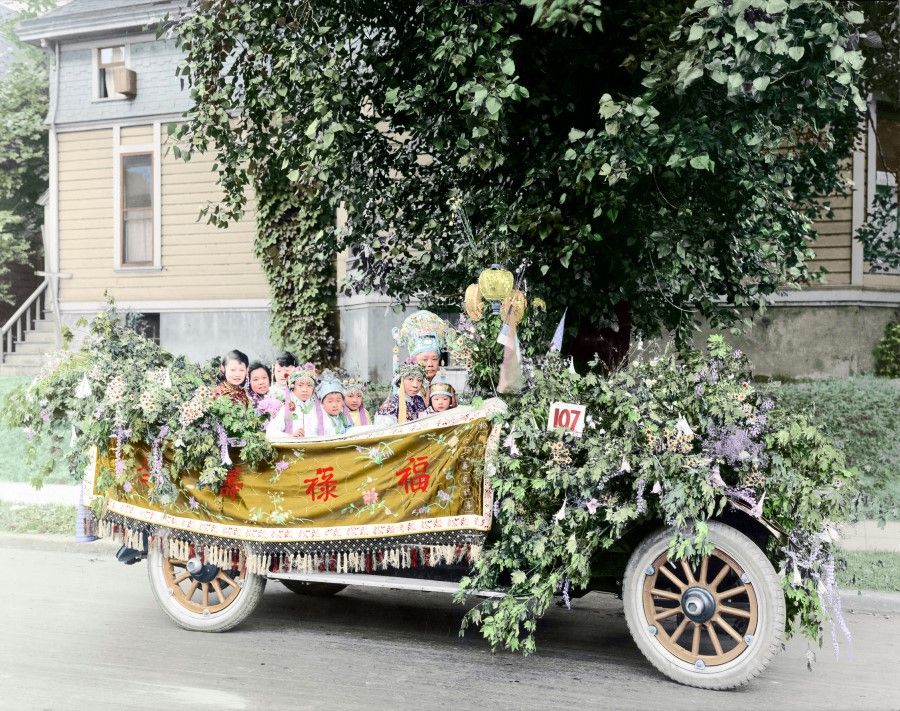 During a birthday celebration in the Seid family, the children wear traditional Chinese clothes as they ride in a car decorated in the Chinese style.