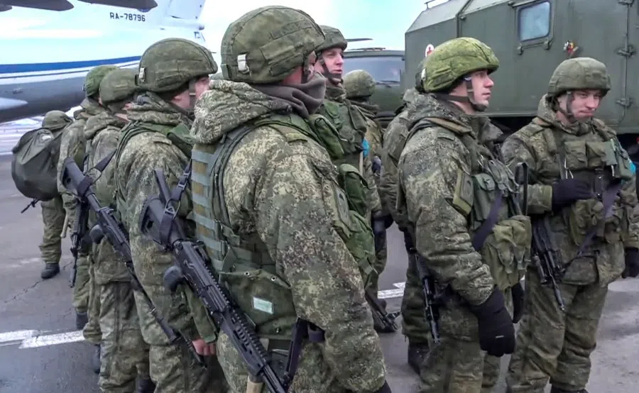 This handout picture taken and released by the Russian Defence Ministry on 9 January 2021 shows Russian peacekeepers unboarding after a military cargo plane landing in Almaty, Kazakhstan. (Handout/Russian Defence Ministry/AFP)