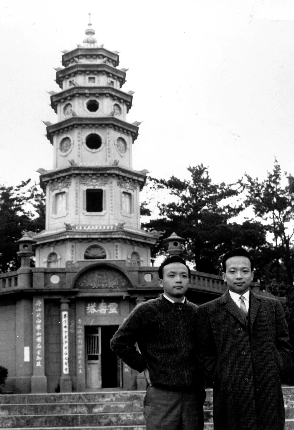 Chang Hsiao-yen (right) and Chang Hsiao-chi taking a photo in front of their grandmother’s tomb in Hsinchu after completing their military service, 1966. Their grandmother was the closest person to them since they grew up without their parents — she told them of their background when they were in the first year of high school, the winter before she died.