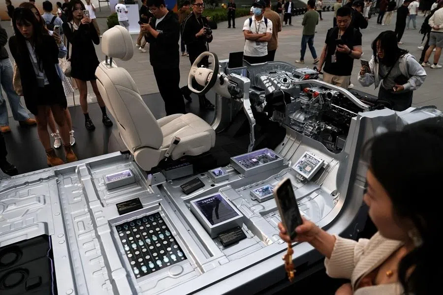 5C high power battery and Xpeng's Turing AI chip are displayed on a cutaway model of a Xpeng's new flagship SUV GX, during the car's launch event in Beijing, China, on 20 May 2026.