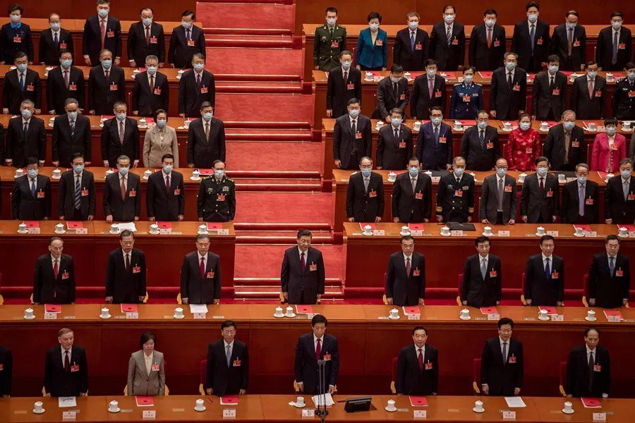China's President Xi Jinping singing the national anthem with other leaders and delegates during the closing session of the National People's Congress at the Great Hall of the People in Beijing on 11 March 2021.