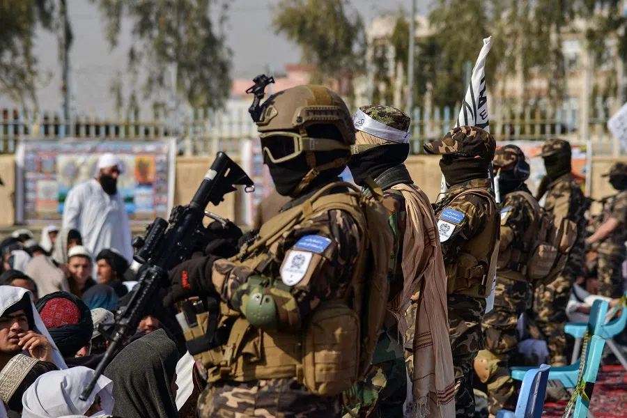 Members of the Taliban Badri 313 military unit stand guard as newly recruited Taliban members who graduated from the Islamic Javadiya Madrassa or Islamic school attend a ceremony in Kandahar on 15 February 2022. (Javed Tanveer/AFP)