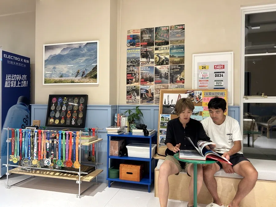 Zhuo Li (left) and her boyfriend run The Blue House, a cycling-themed cafe and guesthouse. (Yush Chau/SPH Media)