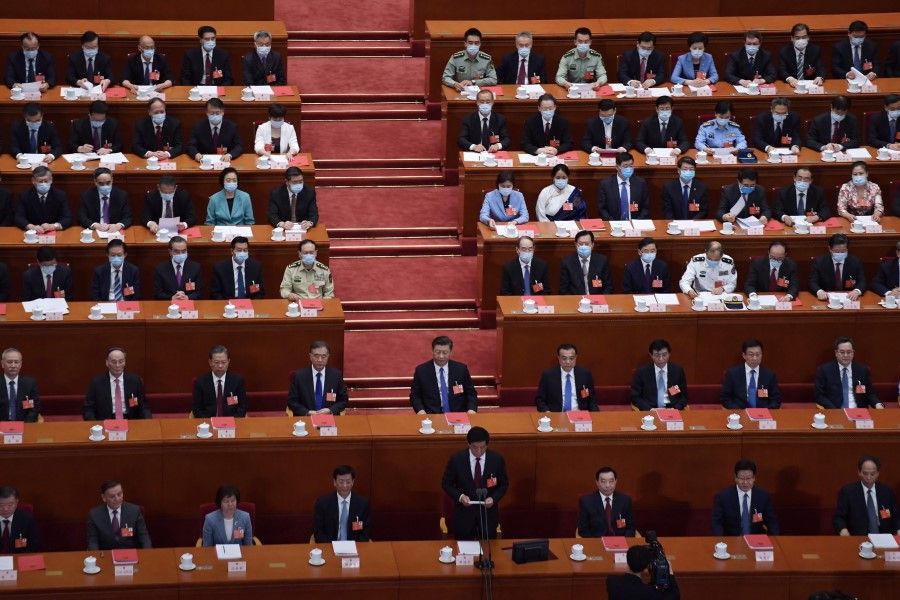 National People's Congress Chairman Li Zhanshu (bottom C) speaks as Chinese President Xi Jinping (C) and other Chinese leaders look on during the closing session of the National People's Congress at the Great Hall of the People in Beijing, 28 May 2020. (Nicolas Asfouri/AFP)
