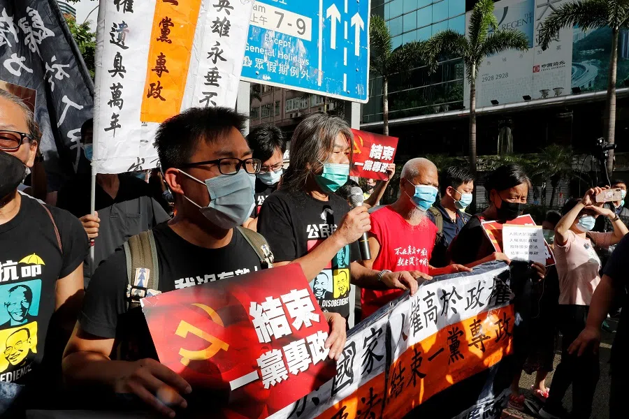 Pro-democracy protesters march during a demonstration near a flag-raising ceremony on the anniversary of Hong Kong's handover to China. (Tyrone Siu/Reuters)