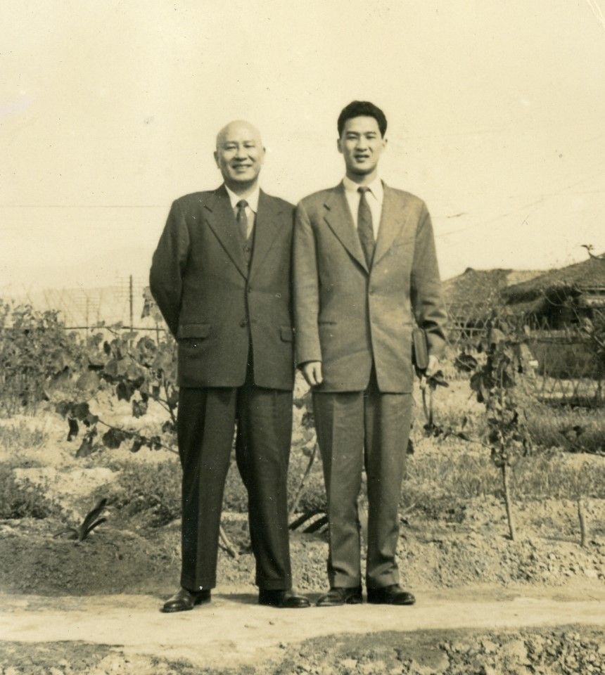 Bai Xiandao (right) with his father during their time in Taiwan.