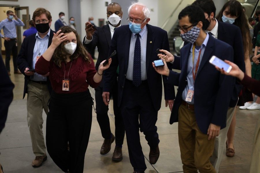 US Senator Bernie Sanders is followed by members of the media at the Capitol 7 October 2021 in Washington, DC. The Senate narrowly voted to increase the debt ceiling by US$480 billion through December 3 in a 50-48 vote. (Alex Wong/AFP)