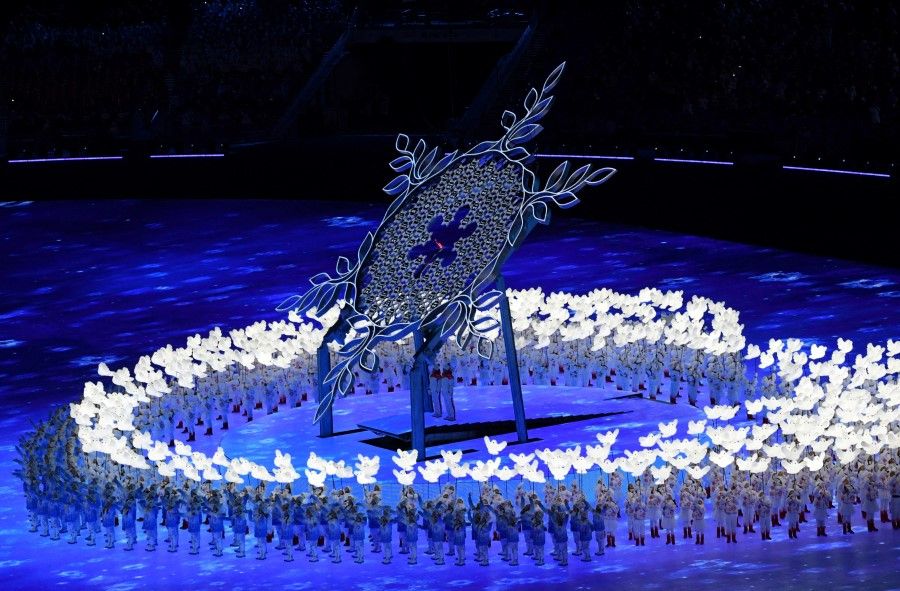 Performers and the Olympic torch during the opening ceremony of the 2022 Beijing Winter Olympics at the National Stadium, Beijing, China, 4 February 2022. (Annegret Hilse/Reuters)