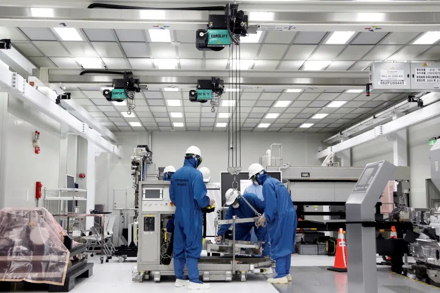 Trainees learn how to build and operate an EUV (extreme ultraviolet) machine at the training center at semiconductor equipment supplier ASML Holding in Tainan, Taiwan, 20 August 2020. (Ann Wang/Reuters)