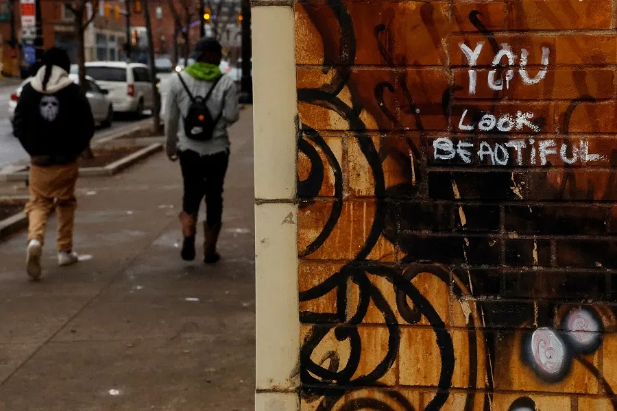 People walk past a mural at High Street in Columbus, Ohio, US, on 19 November 2024. (Shannon Stapleton/Reuters)