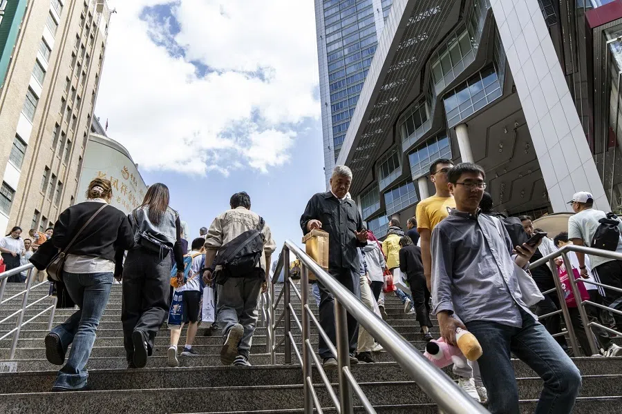 Shoppers on Nanjing East Road in Shanghai, China, 2 October 2024. (Qilai Shen/Bloomberg)