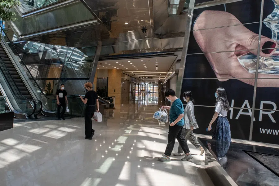 Shoppers walk through a shopping mall in Beijing, China, on 30 May 2022. (Bloomberg)