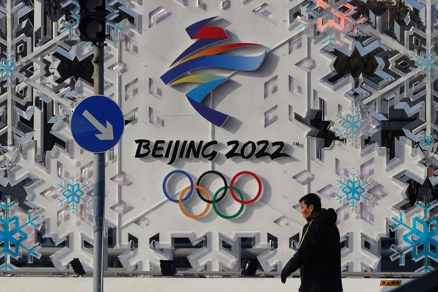 A man walks past an installation of Beijing 2022 ahead of the Beijing 2022 Winter Olympics in Beijing, China, 25 January 2022. (Tyrone Siu/File Photo/Reuters)