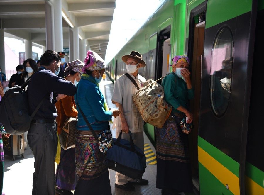 Commuters boarding the Laos-China Railway at Jinghong city, Yunnan, 4 December 2021. (CNS)