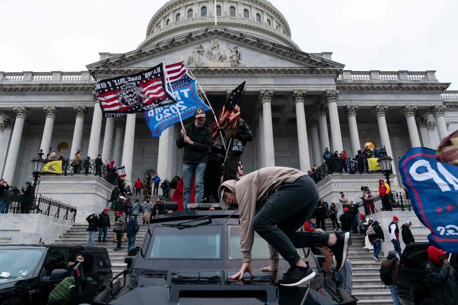 In this file photo taken on 6 January 2021 Supporters of US President Donald Trump protest outside the US Capitol in Washington, DC. (Alex Edelman/AFP)