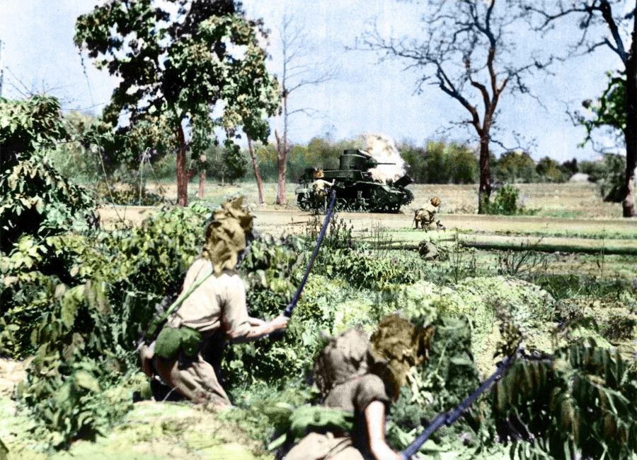 In February 1942, Japanese troops attacked Burma through Thailand. The photo shows the Japanese fighting in the jungles of Burma. The British were unable to withstand the Japanese offensive, and requested the Chinese government to send troops to Burma to rescue the British. On 8 March, the Japanese captured the Burmese capital of Yangon, sending shock waves through India.