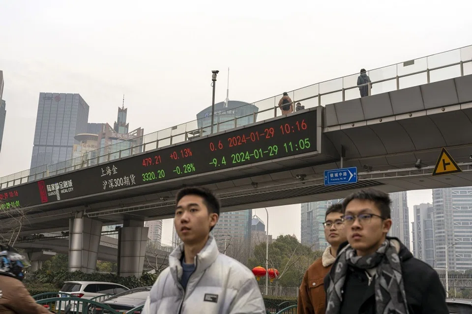 An electronic ticker displays stock figures in Pudong's Lujiazui Financial District in Shanghai, China, on 29 January 2024. (Raul Ariano/Bloomberg)