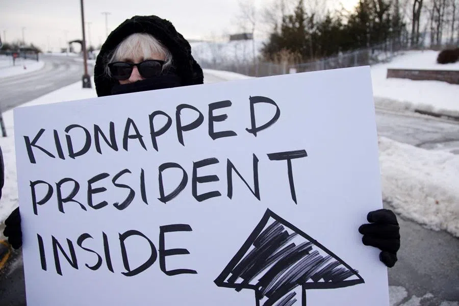 People demonstrate against US military action in Venezuela outside the Stewart Air National Guard Base in Newburgh, New York, on 3 January 2026.
