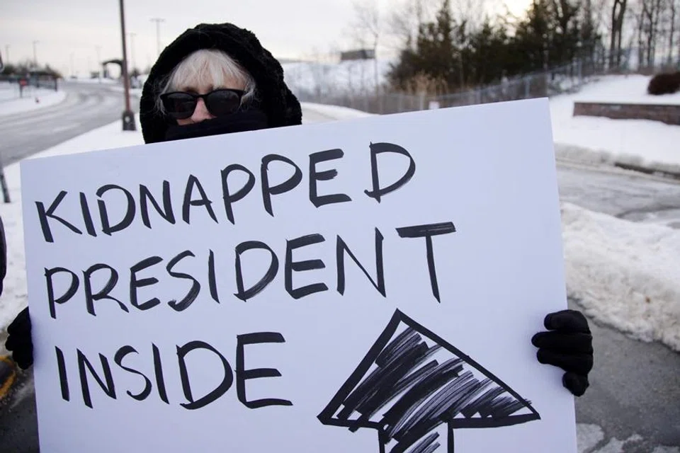 People demonstrate against US military action in Venezuela outside the Stewart Air National Guard Base in Newburgh, New York, on 3 January 2026. (Leonardo Munoz/AFP)