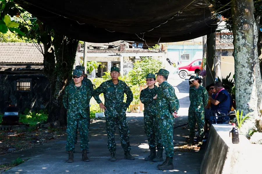 Taiwanese military soldiers rest in the shade during a live-firing exercise with US-made Stinger missile in Pingtung, Taiwan, 4 July 2023. (Ann Wang/Reuters)