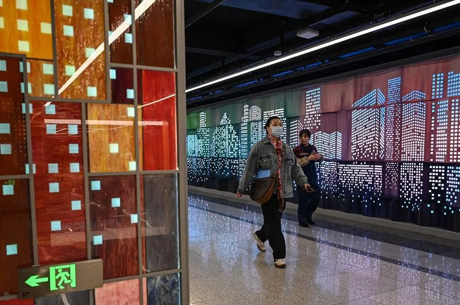 People walk inside a subway station in Shanghai on 31 March 2026. (Jade Gao/AFP)