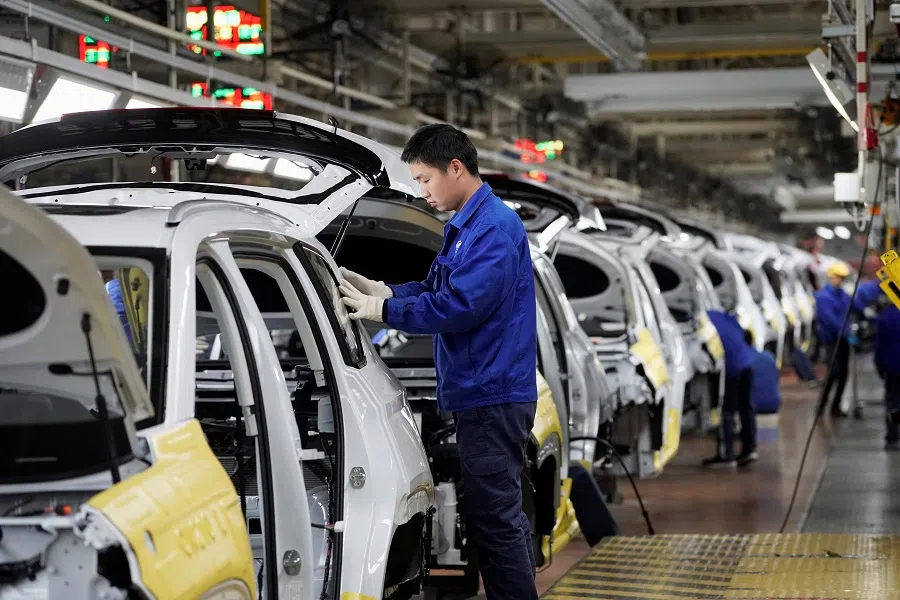 Employees work at an assembly plant in Liuzhou, Guangxi Zhuang Autonomous Region, China, on 28 February 2019. (Aly Song/Reuters)