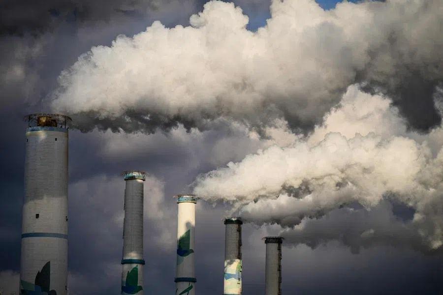 A general view shows exhaust gases billowing from the chimneys of the Taean Thermal Power Station, a large coal-fired power station owned by Korean Western Power Co, in Taean on 17 November 2025. (Anthony Wallace/AFP)