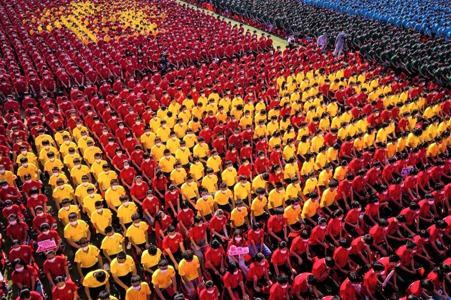 University students form an image to mark the 100th anniversary of the founding of the Communist Party of China during an opening ceremony of the new semester in Wuhan in China's central Hubei province on 10 September 2021. (STR/AFP)